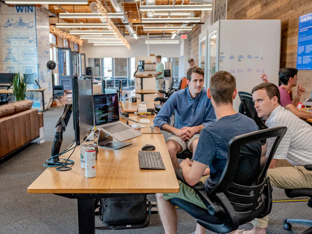 Founders laughing together while working